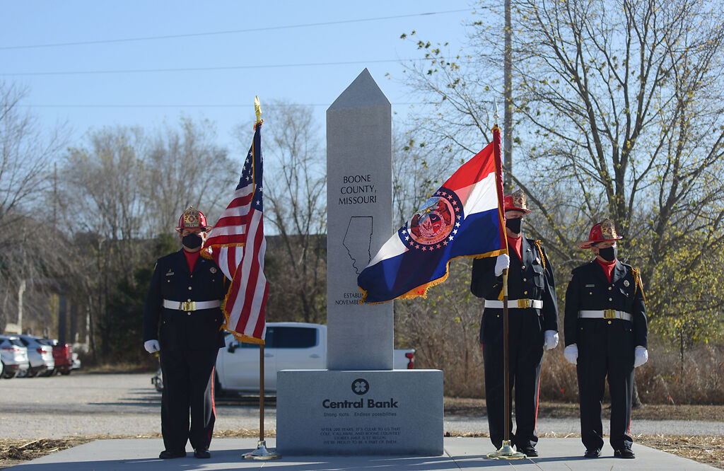 Nathan Luebbering, Gary Berendzen and Steve Cearlock with the Cole County Honor Guard stand by the bicentennial statue